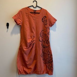 Half sleeves midi dress in Orange, black flower printed on the left side.Size L